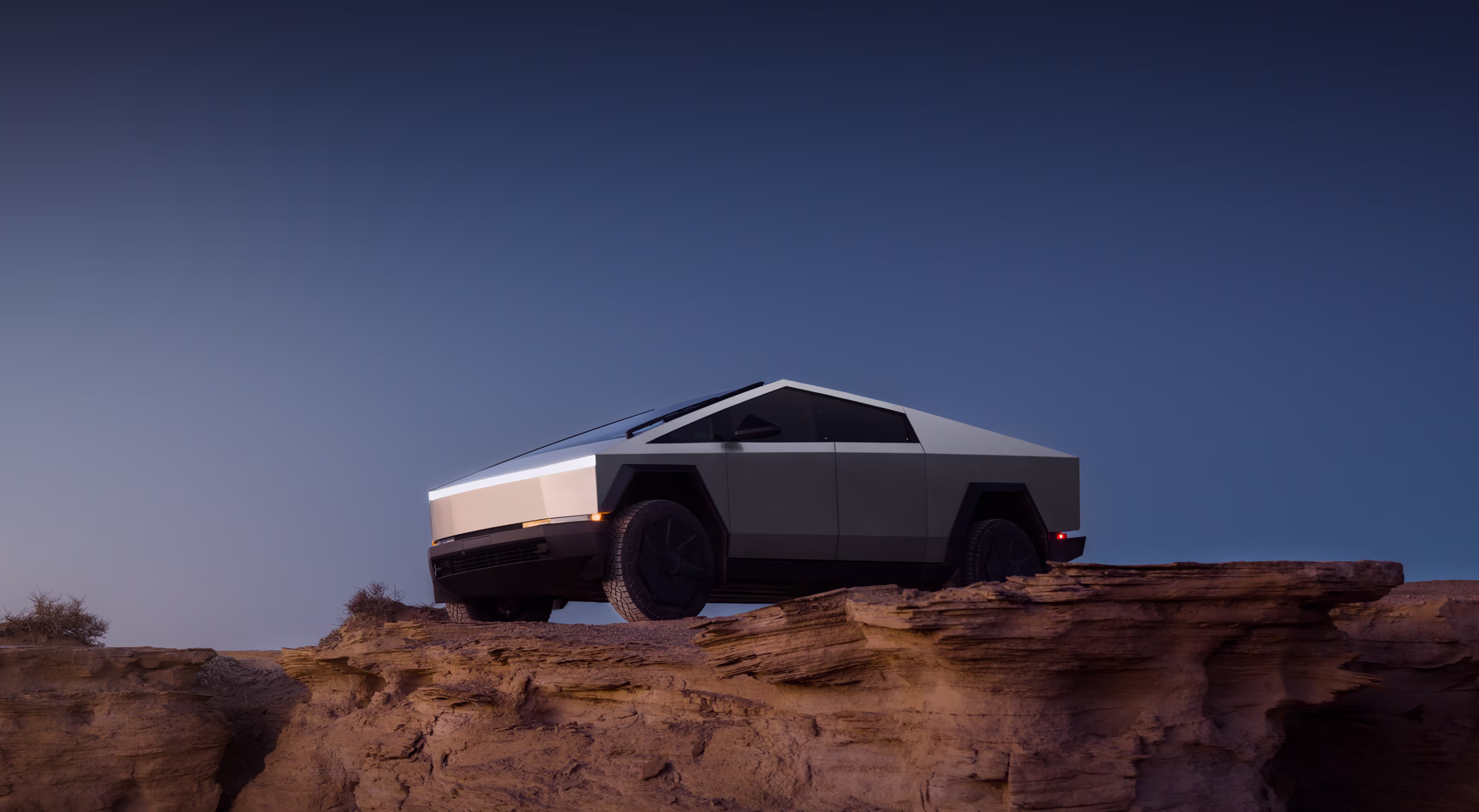 Tesla Cybertruck Hero — acero inoxidable angular en estudio oscuro, Desktop NA/SA/APAC