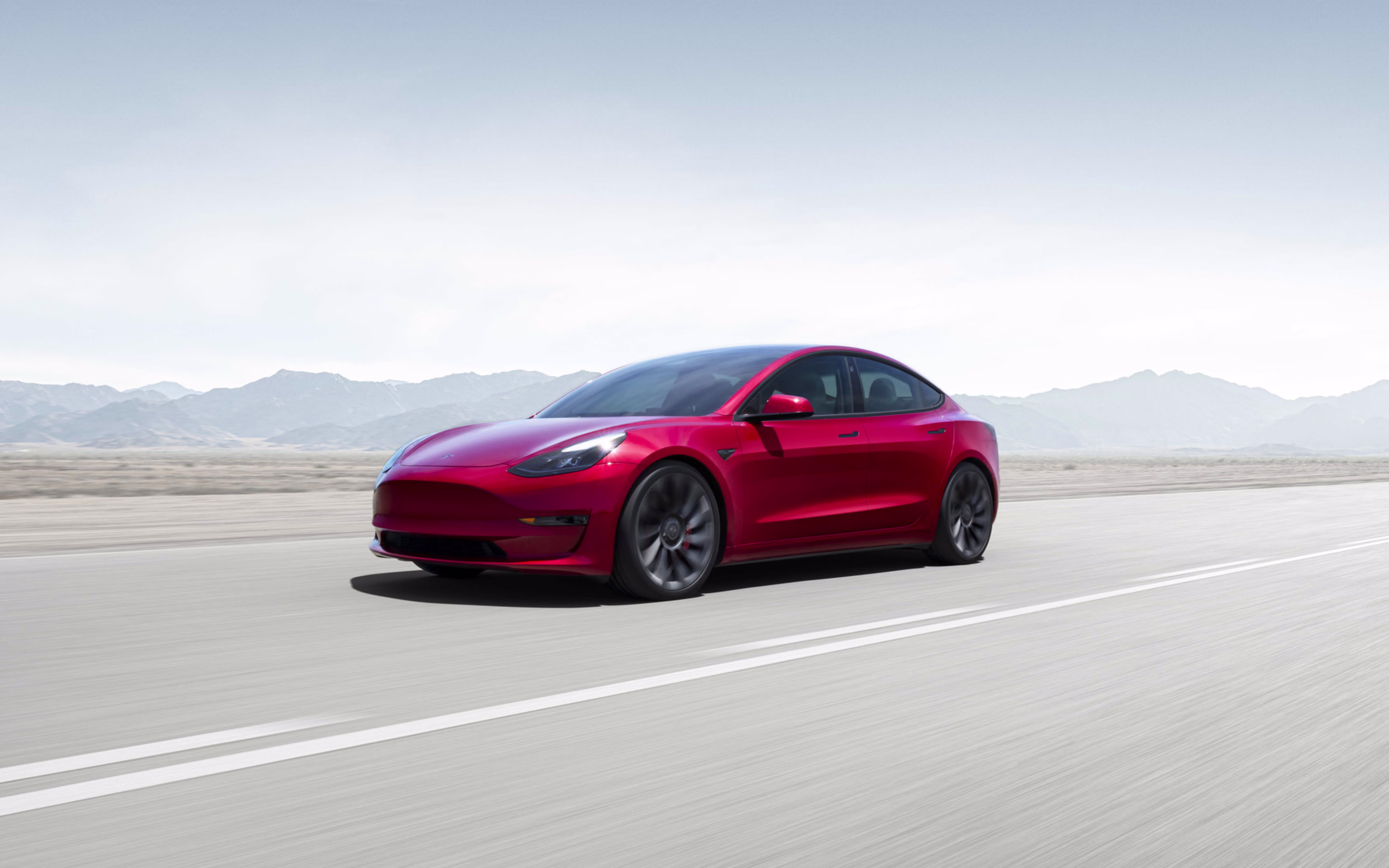 Tesla Model 3 Midnight Silver Metallic on mountain road