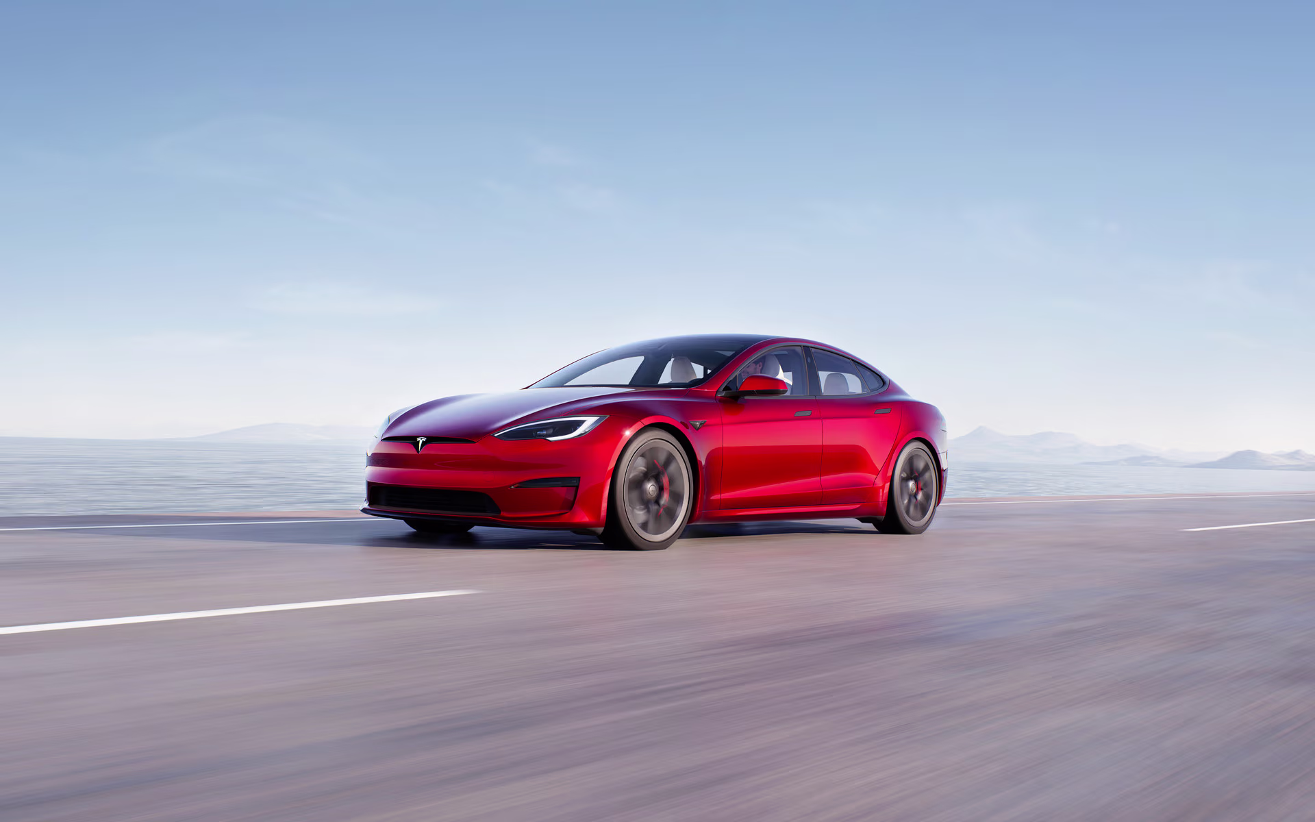 Tesla Model S Ultra Red in motion on highway